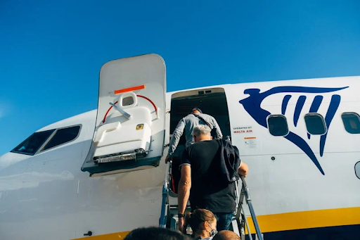 People boarding a plane