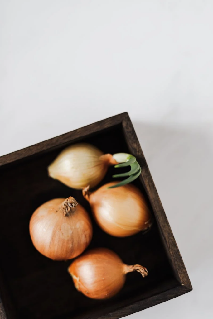 Raw onions on a board